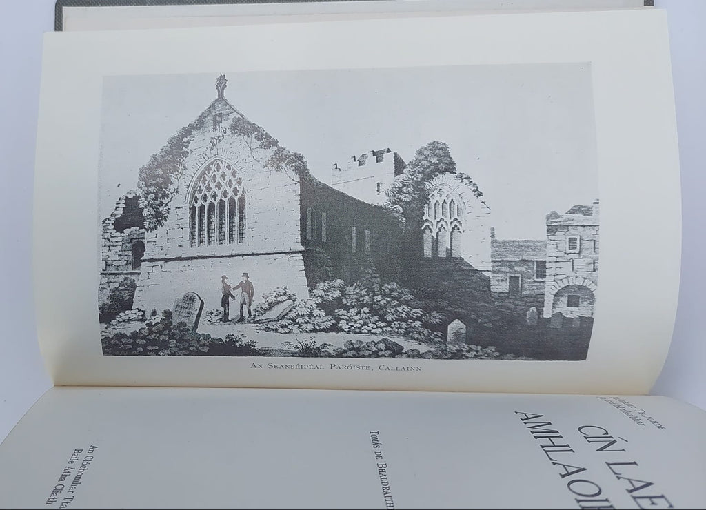 Open book with black and white illustration of a building on a plain background